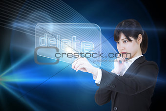 Businesswoman pointing to word delete
