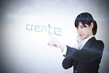 Businesswoman pointing to word create