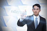 Businessman pointing to word external