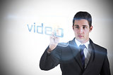 Businessman pointing to word video