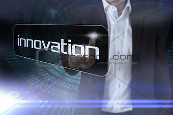 Businessman pointing to word innovation