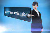Businesswoman pointing to word communicate