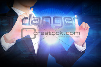 Businesswoman presenting the word danger