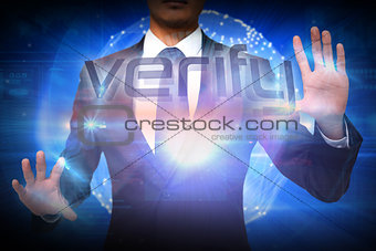 Businessman presenting the word verify