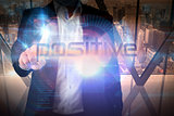 Businessman presenting the word positive