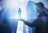 Composite image of businessman holding architect