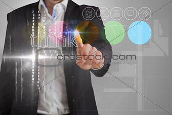 Businessman touching the word think on interface