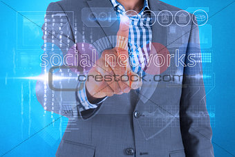 Businessman touching the words social networks on interface