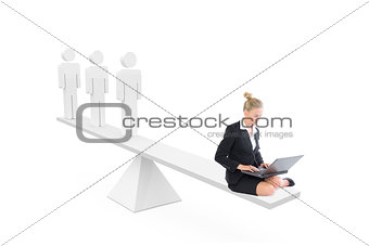 Scales weighing businesswoman using laptop and stick men