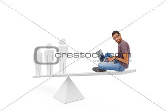 Scales weighing man using laptop and stick men