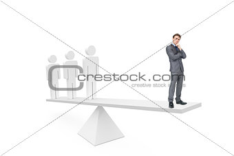 Scales weighing thoughtful businessman and stick men