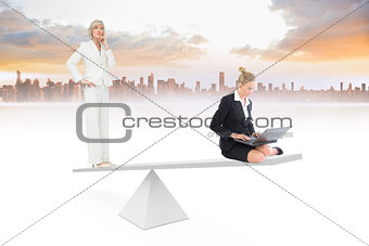 White scales weighing two businesswomen