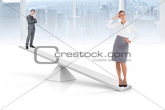 White scales weighing businessman and businesswoman