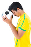 Football player in yellow with ball