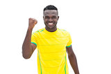 Football player in yellow celebrating a win
