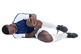 Football player lying down injured