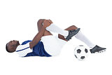 Football player lying down injured