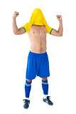 Happy football player in yellow celebrating