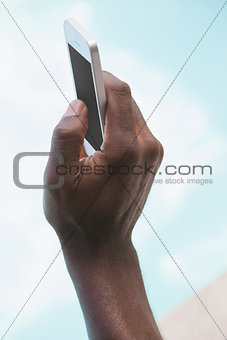 Man holding smartphone in hand