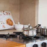 Stove top with saucepan and recipe book