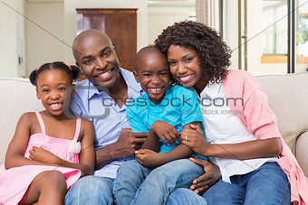 Happy family relaxing on the couch