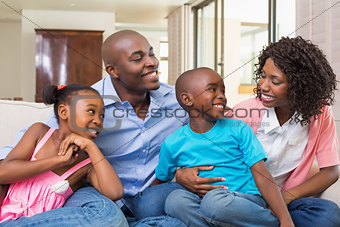 Happy family relaxing on the couch