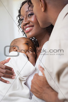Happy parents spending time with baby