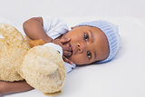 Adorable baby boy with teddy