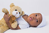 Adorable baby boy with teddy