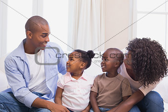 Happy family sitting on the couch together