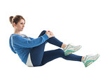 Side view of woman doing pilates exercises