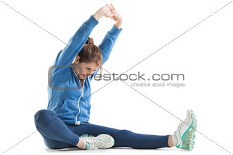Young woman stretching up hands