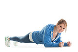 Smiling young woman in basic plank posture
