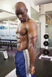 Shirtless muscular man in gym