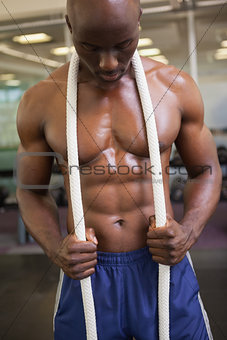Muscular young muscular man in gym