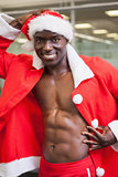 Macho man in santa costume at the gym
