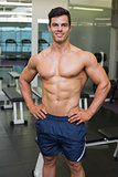 Shirtless muscular man in gym
