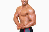 Shirtless muscular man posing