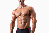 Smiling shirtless muscular man