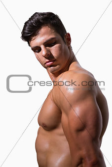 Side view of a shirtless muscular man