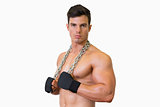 Portrait of a serious shirtless muscular man