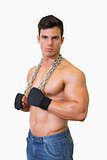 Portrait of a serious shirtless young muscular man