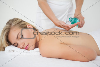 Beautiful blonde enjoying a back massage