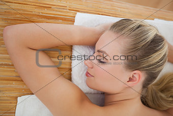 Beautiful blonde relaxing on massage table