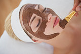 Beautiful blonde getting a chocolate facial treatment