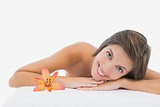 Close up portrait of a beautiful young woman on massage table
