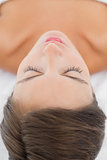 Close-up of a beautiful woman lying on massage table