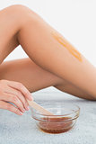 Female leg with hot wax at spa center