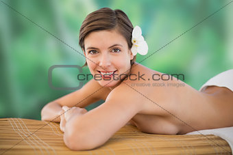 Beautiful woman on massage table at health farm
