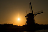Siluet of dutch windmill (Kinderdijk) in sunset